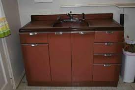 Underbar sinks can fit beneath work surfaces, so they're perfect for small kitchens. How Old Is This Metal Cabinet And Kitchen Sink Retro Renovation
