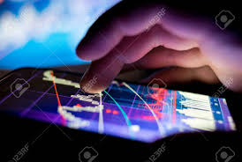 a businessman checking stock charts on a mobile device