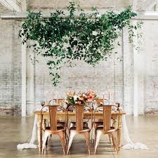 Often the owners of banquet rooms and restaurants are allowed to decorate their premises only with those decorative elements that are easy to remove, so the newlyweds will likely have to be content with simple decor. Amazing Hanging Greenery Installations For Your Wedding
