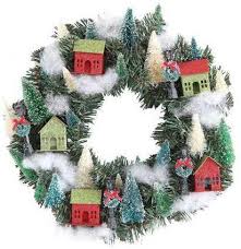 These wreaths come in a variety of different styles giving you the opportunity to find the right one that suits your home. Christmas Glitter Village Wreath With Putz Houses Trees Lamp Posts Theholidaybarn Com
