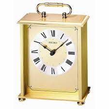 Though this may seem like a standard desk or table clock with handsome wood accents and carvings, it includes an alarm feature for extra functionality. Seiko Qhg102gl Carriage Clock The Clock Depot