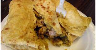 Roti Indian Tradition From Trinidad Can Be Eaten With Curried Chicken Goat Beef Or Duck Trini Food Jamaican Ginger Beer Recipe Caribbean Recipes