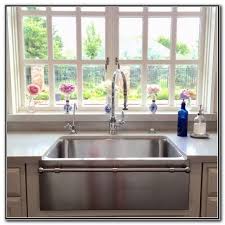 Stainless steel apron sink cheap, we sell undermount stainless steel is the timeless ruggedyetwarm image credit signature hardware. Stainless Steel Farmhouse Sink With Towel Bar Sink And Faucets Home Decorati Modern