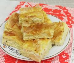 Placinta aurie, rumena, cu umplutura generoasa, cremoasa, usor picanta. Varzari Placinte Cu Varza