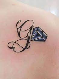 Round ornament with graceful capital letter g. 50 Letter G Tattoo Designs Ideas And Templates Tattoo Me Now