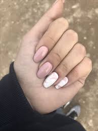 dusty pink nails and two white and dusty pink marble nails that bring a trendy and edgy feel to the look pinkandwhit nagellackfarben rosa nagel nagellackfarbe