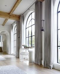 Floor To Ceiling Drapes Around These Arched Black Window Frames Hardenburg Designs Black Window Frames Curtains For Arched Windows Arched Window Treatments