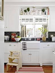 Had we placed objects up there, do you see how they would have distracted the eye from the island and those gutsy light fixtures? 10 Stylish Ideas For Decorating Above Kitchen Cabinets