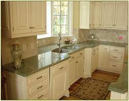 This kitchen is a perfect example of how granite can enhance a design by being a major focal point. Light Green Granite Countertop Green Granite Countertops Green Countertops Granite Countertops