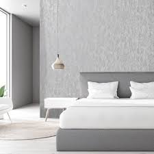 In a mostly monochromatic bedroom in a new york apartment by arent and pyke design studio, modern yellow wallpaper lends a casual burst of room brightening color. Holden Decor Industrial Texture Grey Metallic Wallpaper 12840
