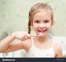 Little Girl Brushes Teeth