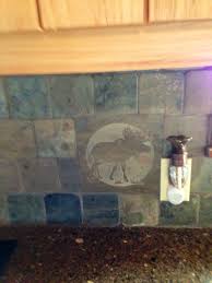 The Tile Backsplash In The Kitchen At Our Cabin It S Got Dear Bear Elk Moose Throughout Cabin Kitchens Cabin Decor Cabin Style