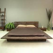 The bed is a low profit platform bed with solid wood slats and an offset headboard, idea for resting back against for comfort or a late night read. Delta Low Profile Platform Bed Platform Bed Designs Japanese Bed Bed Frame Design