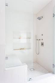 Walk In Shower Features A Glass Partition And A Bench Fixed Against White Hexagon Floor Tiles In 2021 Bathroom Remodel Shower Master Bathroom Shower White Tile Shower