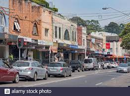 Traffic Stopped For A Red Light At A Pedestrian Crossing In Hampden Road Artarmon In Sydney Federation Art Deco Shops And Offices Line The Street Stock Photo Alamy