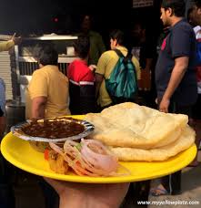 Boasting of a kitchen run by apparently sixteen chefs, straight from punjab, bhangra punjabi dhaba has quite a fan following for its chole bhature.served on a massive thali, the chole bhature here come with fried green chili, raw masala onions, and tomatoes.they also serve freshly churned mint chutney and kulcha chutney that is a mix of ginger, tamarind, green chilli, and honey along with a. 15 Legendary Places To Eat The Best Chole Bhature In Delhi 2021 My Yellow Plate