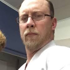 Who can hem a karate uniform in Conroe?