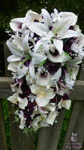 A bright mix of casablanca lilies, stargazer lilies, orchids and calla lilies. Dress My Wedding Cascading Plum Bridal Bouquet With Casablanca Lilies Picasso Calla Lilies