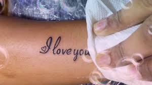 'bird' tattoo on the left front side of her hip bone. Love You More Tattoo Youtube