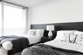 W 43 x d sleek black velvet upholstery gives this bed a true upscale feel and epitomizes fine living while channel tufting along the headboard keeps the padded. Long Black Headboard With Two Twin Beds Transitional Bedroom