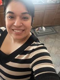 Chihuahua selfie in a dark room.