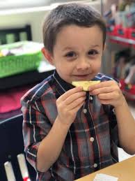 Ms. McGuire's kindergarten class at Hawthorne Elementary School learned  about their five senses. While learning about their sense of taste, they  practiced sensing different taste sensations by making a snack mix using