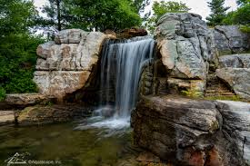 We specialize in ponds, waterfalls and fountains. Aquascape Signature Pond Aqualand Headquarters Water Feature