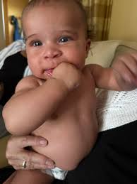 My 2.5 month old girl suddenly is super fussy when latching and takes 5-10  minutes to settle down and actually eat. Is this a sign of sleep regression  or a growth spurt?