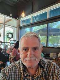 Why do I smile with one side and look mean with the other?