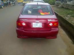 Mirror caps gray metallic sport side rocker panels and rear spoiler. Toyota Corolla Price In Nigeria