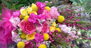 This Sheaf Bouquet Shows Off A Swirl Of Bright Pinks And Yellows Including Larkspur Boronia Heather And Craspe Wedding Flowers Wholesale Fresh Flowers Flowers