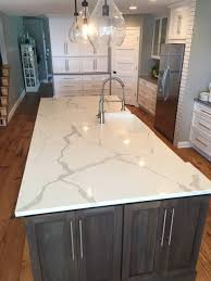 This is the only countertop material that will adapt to your kitchen, rather than your kitchen adapting to the countertop. Sparkling White Quartz Countertops Inspirations With Pros And Cons Kitchen Remodel Countertops White Quartz Countertop Kitchen Marble