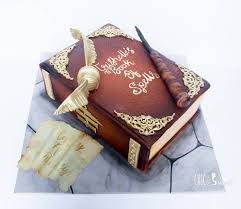 trishelle s spell book for her 7th birthday the aged leather look on the book cover and the hand writte harry potter cake harry potter kids harry potter bday