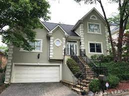 To add a little color to your stucco home without a total facelift, painting your shutters a darker, more vibrant shade helps the house stand out. Stucco Before Patsy Overton Interiors