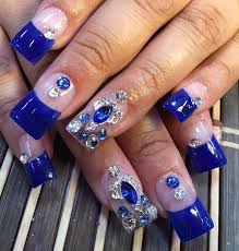 Sunflower nail design with light blue polish | sunflower nails. Experience The Glamorous Style Of Royal Blue Nail Designs Be Modish