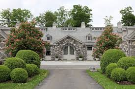 martha stewart s stables at bedford boxwood hedge stone barn painted bedford gray dream horse barns dream barn barn decor martha stewart s stables at bedford