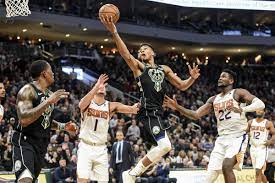 Milwaukee bucks giannis antetokounmpo, left, drives to the basket against phoenix suns' cameron johnson, center, during the first half of an nba phoenix suns' devin booker, center, is fouled as he shoots between milwaukee bucks' jrue holiday, right, and giannis antetokounmpo, left, during the. Bucks Vs Suns Game Thread Brew Hoop