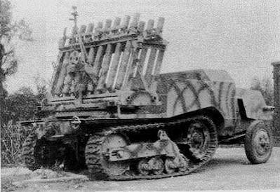 A quite odd SPA vehicle built by the Baukommando Becker, consisting of French halftracks with several French 8.14cm mortars. It was called Schwerer/Leichter Reihenwerfer SPW 303 (f), additional info in the comments :