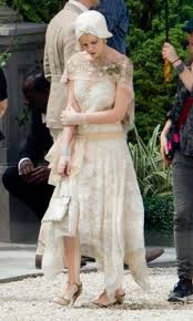 She has a deep, melodious and right now, of course, she's everywhere, as the iconic daisy buchanan in baz luhrmann's frenetic the great gatsby. Carey Mulligan On Set In The Great Gatsby Great Gatsby Fashion Gatsby Costume 1920s Inspired Fashion