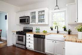 The combination of white kitchen cabinets with wood countertops is a beautiful effect that can be presented in a variety of different ways depending on the intensity and color of the stain that is used. 16 Modern Kitchens With Butcher Block Countertops