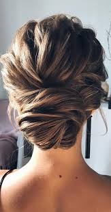 Take some strands and twist them behind your head to form the knot which you then secure with bobby pins. Updos For Every Hair Type And Length Textured Updo For Medium Length