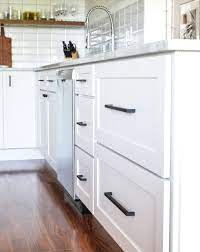Yet, putting these beautiful cherrywood handles on your white cupboards will give your kitchen a touch of midcentury present day. White Kitchen Dark Handles Instaimage