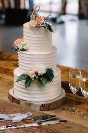 Elegant white wedding cake by joy thigpen shot by ali harper via once wed silver metallic wedding cake via brides White Wedding Cake With Peach Flowers Image Polka Dot Wedding