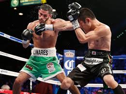 Jorge Linares of Barinas Venezuela, left, trades punches with Nihito  Arakawa of Musashino Japan during their lightweight boxing match, Saturday,  March 8, 2014, at The MGM Grand Garden Arena in Las … |