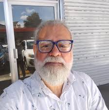 What kind of rainwear is needed for travel to Costa Rica's Caribbean side,  Tortuguero and Cahuita in July?