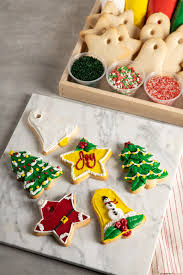 Plate with christmas gingerbread cookies decorated with wreath made of rosemary on white table. Christmas Cookie Decorating Kit With Decorated Cookies Buttercream And Sprinkles Nugget Markets Image