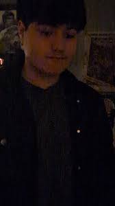 Peter with A Trench Coat Against A Wall