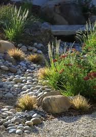 Landscape Ideas And Garden Design Pictures Remodels And Decor River Rock Garden River Rock Landscaping Mediterranean Landscaping