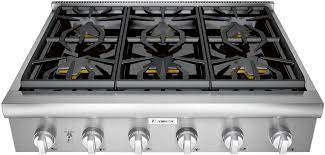 In general, gas ranges provide better rangetop temperature control than electric ranges, but lack performance at the margins of simmering and searing. Thermador Pcg366w 36 Inch Gas Rangetop With 5 Star Burner Continuous Cast Iron Grates 2 Extralow Simmer Burners Quickclean Base Led Downlighting Metal Knobs And Star K Certified
