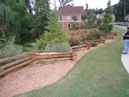 Split rail fences are constructed out of timber logs, typically split in half lengthwise to form the rails. Split Rail Fence Landscape Handmade Log Fence In A Jagged Pattern Lines The Forrest As Autumn Leaves Create A Blanket Of Brilliant Colors On The Ground
